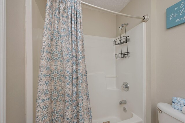 285 Payne Street 23B, Walton Beaches, FL 32550 - bathroom featuring shower / bath combination with curtain and toilet