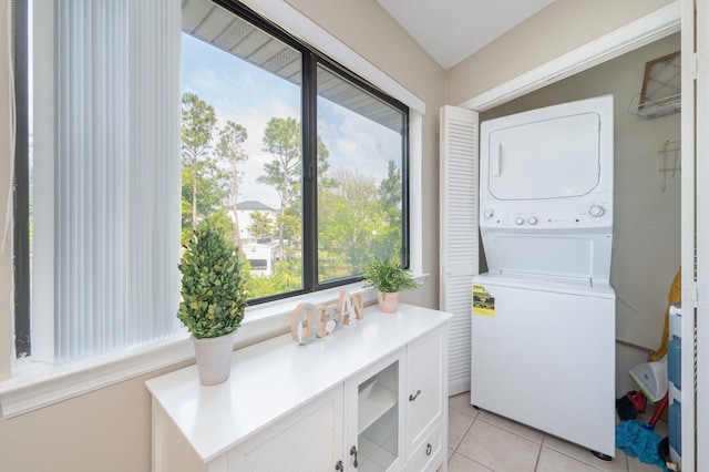 285 Payne Street 23B, Walton Beaches, FL 32550 - laundry room with stacked washer / dryer and light tile patterned flooring