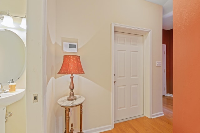 corridor featuring light hardwood / wood-style floors