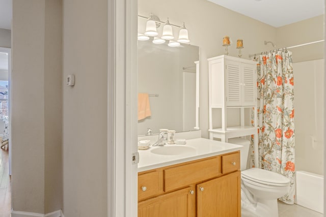 full bathroom featuring tile patterned flooring, vanity, shower / bath combo, and toilet