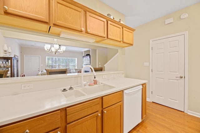 kitchen with sink, a notable chandelier, white dishwasher, light hardwood / wood-style floors, and light brown cabinets