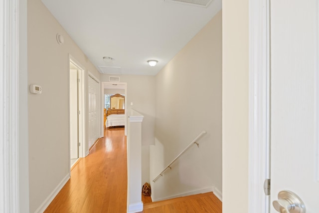 corridor featuring light hardwood / wood-style floors