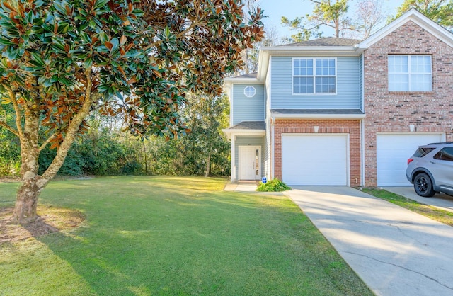 view of front of property featuring a garage and a front lawn