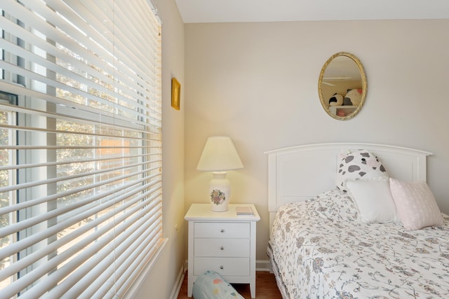 bedroom with dark wood-type flooring