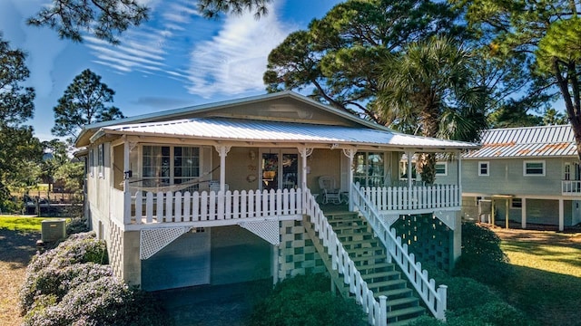 view of front of house featuring central AC and a porch