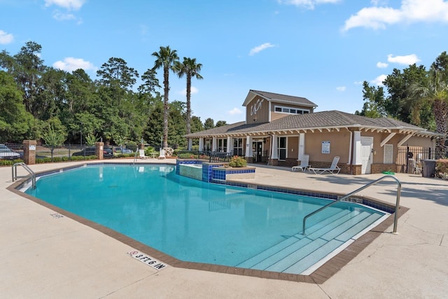 view of swimming pool with a patio