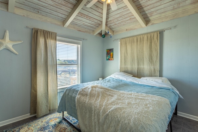 tiled bedroom with ceiling fan, wood ceiling, wooden walls, and lofted ceiling with beams