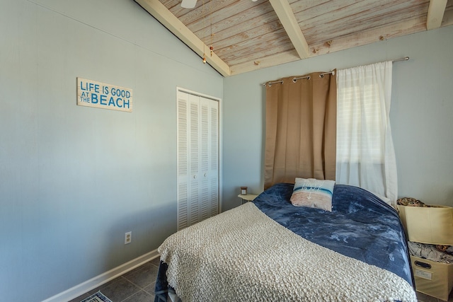 tiled bedroom with wood ceiling, a closet, and lofted ceiling with beams