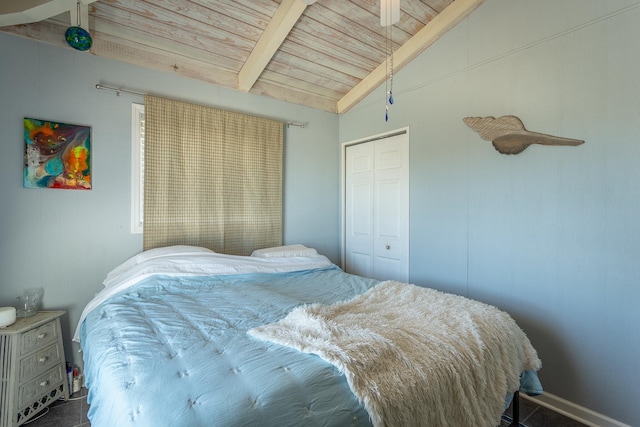 bedroom with wood ceiling, a closet, and lofted ceiling with beams