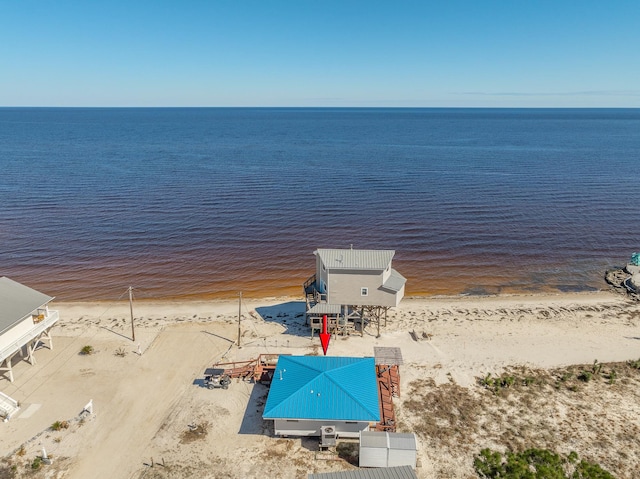 drone / aerial view with a view of the beach and a water view