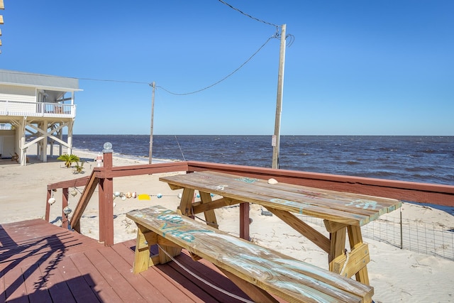 dock area with a deck with water view