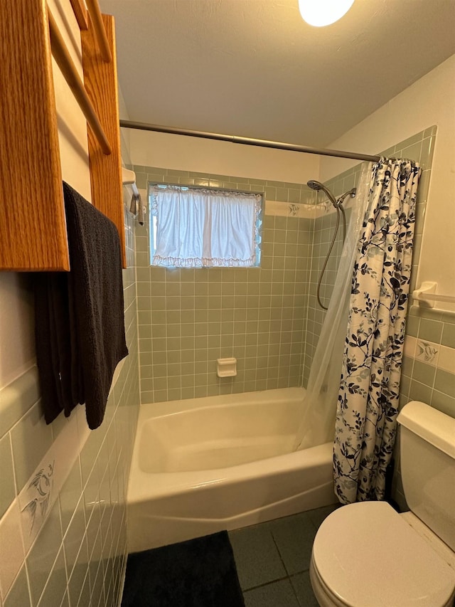 71 Royster Dr, Crawfordville, FL 32327 - full bathroom featuring tile walls, shower / bathtub combination with curtain, toilet, and tile patterned floors