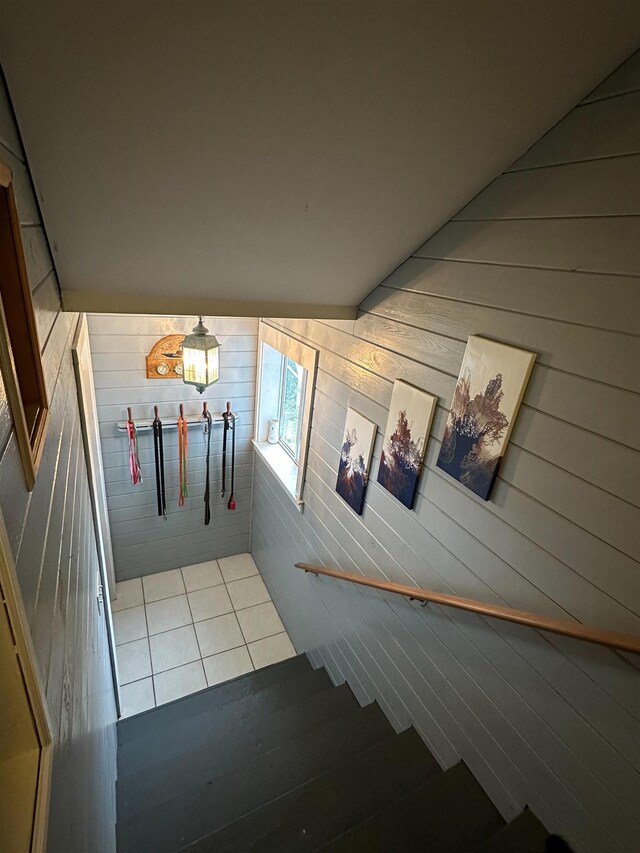 71 Royster Dr, Crawfordville, FL 32327 - stairway with tile patterned floors and wood walls
