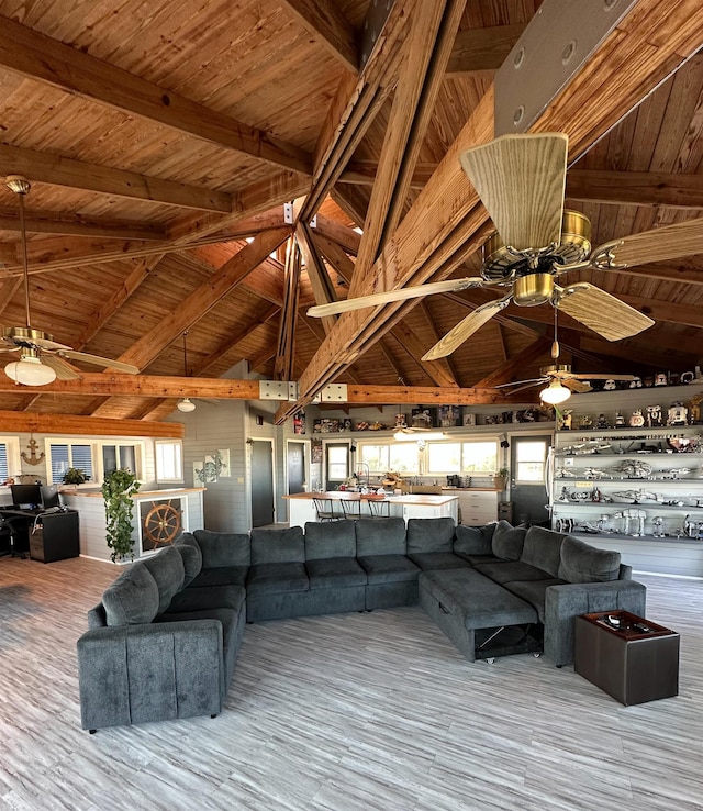 71 Royster Dr, Crawfordville, FL 32327 - living area with a ceiling fan, wood ceiling with exposed beams, high vaulted ceiling, and wood finished floors