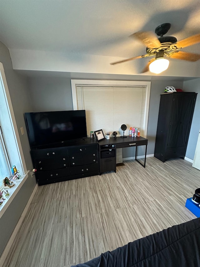 71 Royster Dr, Crawfordville, FL 32327 - living room featuring light wood-style flooring, baseboards, and a ceiling fan