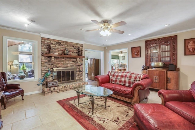 living area featuring a ceiling fan, a fireplace, baseboards, and crown molding