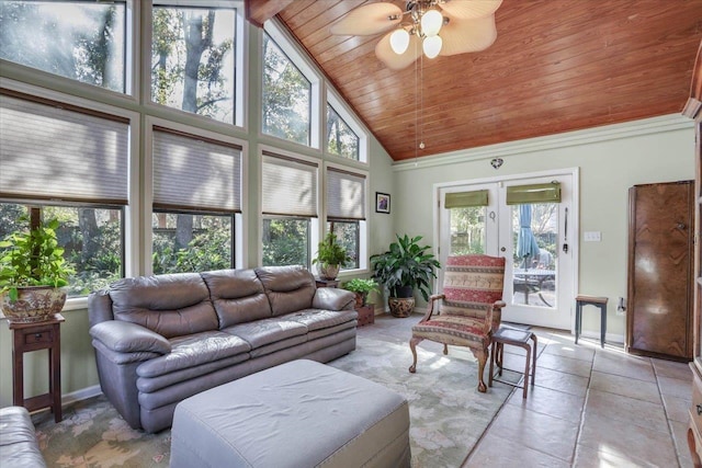 sunroom featuring a ceiling fan, lofted ceiling, french doors, and wooden ceiling