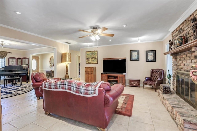 living room with light tile patterned floors, visible vents, a ceiling fan, ornamental molding, and a brick fireplace