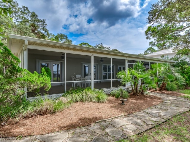 view of front of house featuring a sunroom