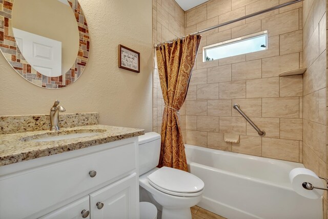 full bathroom with vanity, toilet, and shower / tub combo