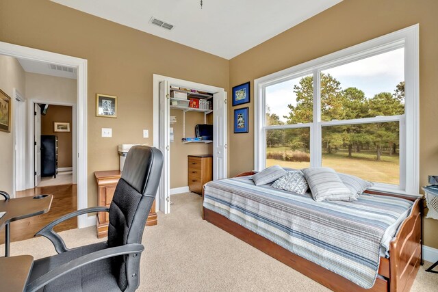 bedroom with light carpet