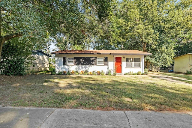 ranch-style house with a front lawn