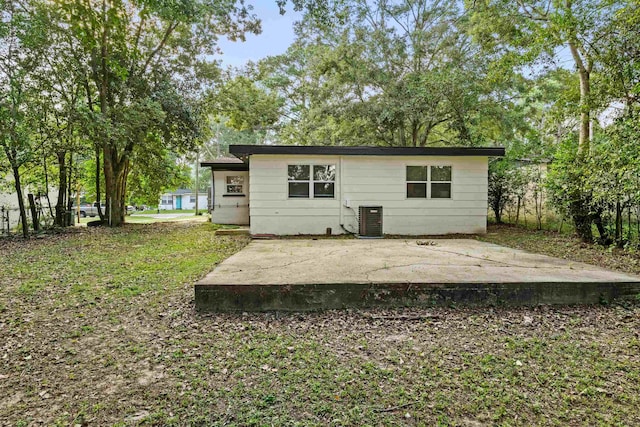 back of property featuring cooling unit