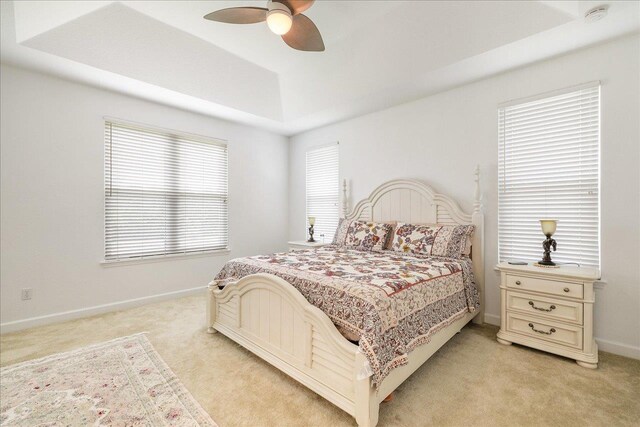 3686 Longfellow Rd, Tallahassee, FL 32311 - bedroom with light colored carpet, a raised ceiling, baseboards, and ceiling fan