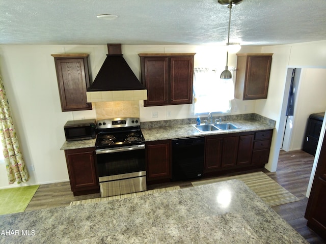 kitchen with wood-type flooring, sink, premium range hood, and stainless steel appliances