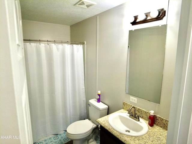 bathroom featuring walk in shower, vanity, a textured ceiling, and toilet