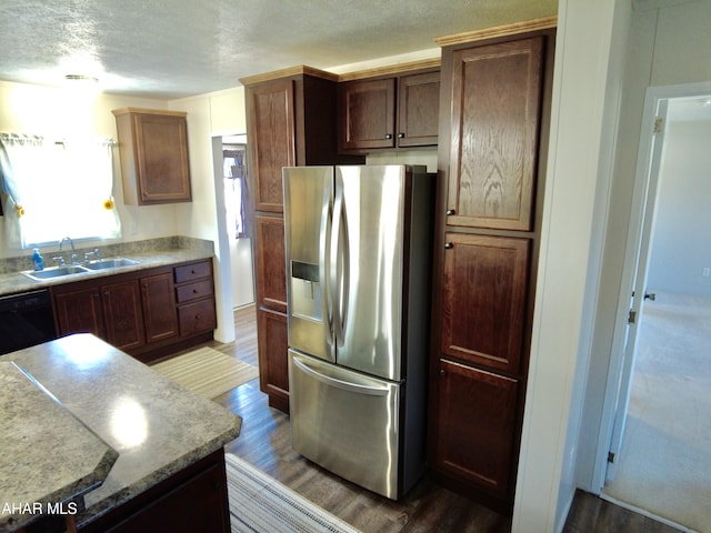 kitchen with stainless steel refrigerator with ice dispenser, black dishwasher, dark wood-type flooring, and sink