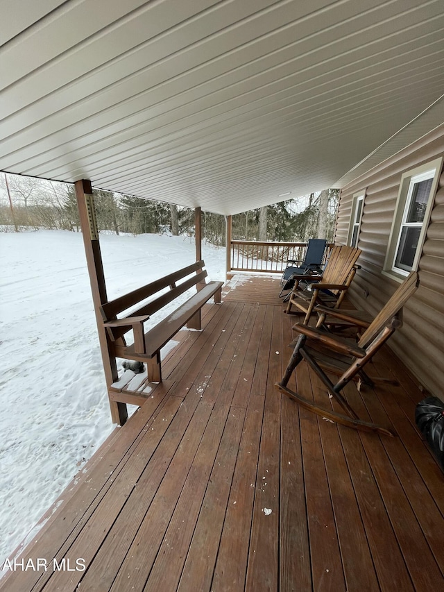 view of snow covered deck