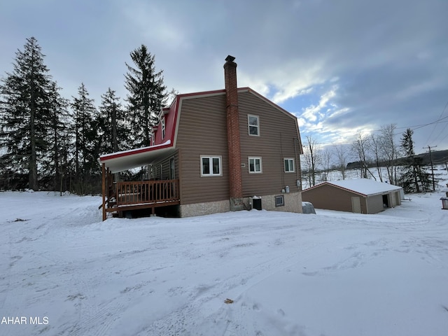 view of snow covered house