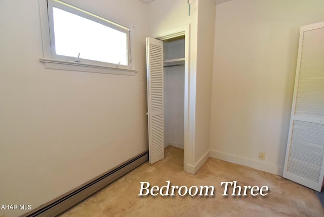 closet featuring baseboard heating