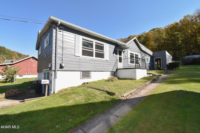 view of home's exterior featuring a yard