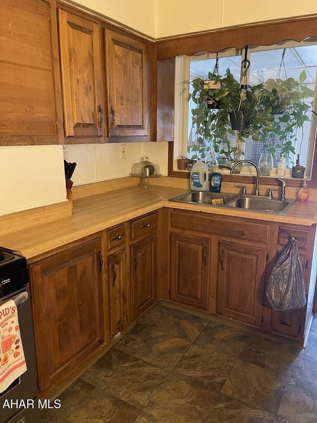 kitchen featuring sink and stainless steel range