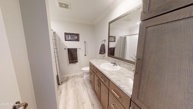 316 Goss Dr, Hollidaysburg, PA 16648 - bathroom featuring vanity, toilet, ornamental molding, wood finished floors, and baseboards