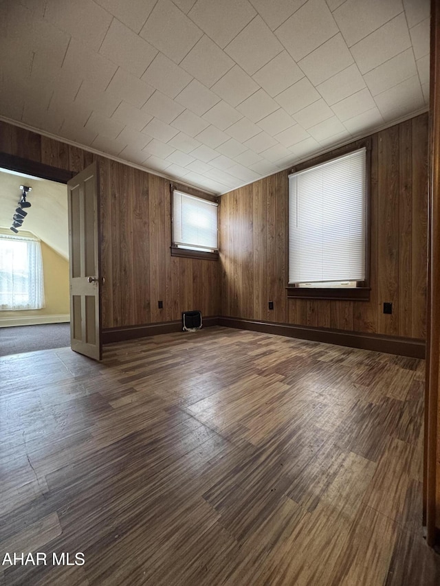 607 N N 8th Ave, Altoona, PA 16601 - empty room with wood walls and dark wood-type flooring