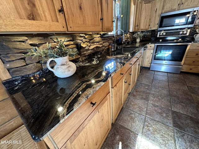 kitchen featuring appliances with stainless steel finishes and sink