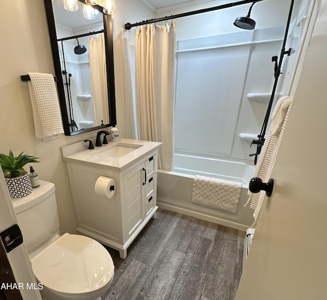 full bathroom featuring shower / bathtub combination with curtain, vanity, hardwood / wood-style flooring, and toilet