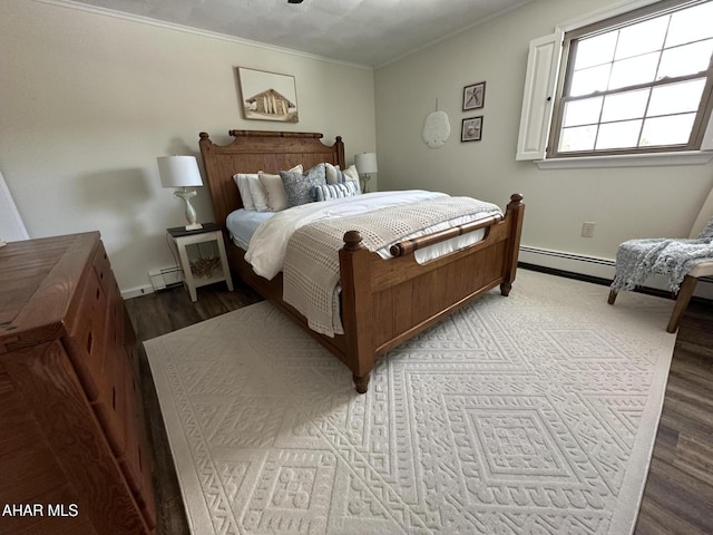 bedroom with a baseboard radiator, ornamental molding, and light hardwood / wood-style floors