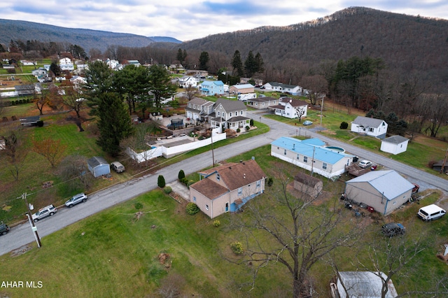 birds eye view of property featuring a mountain view