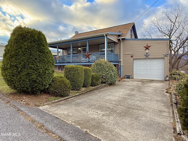 view of front of property with a porch and a garage