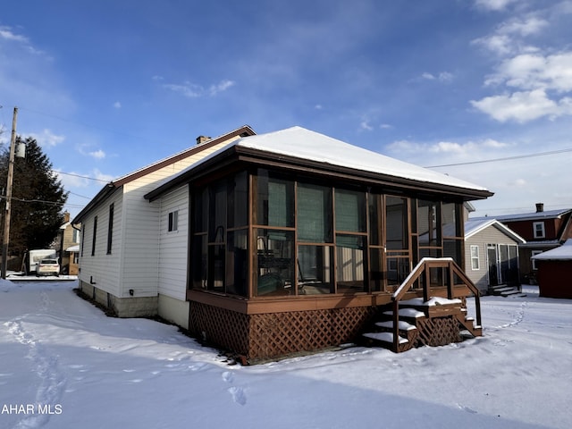 exterior space with a sunroom