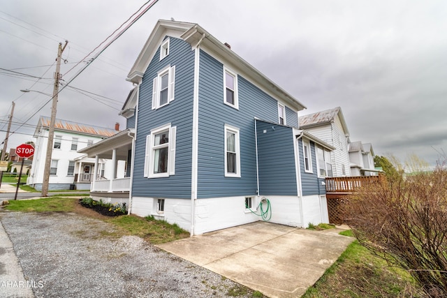 213 N Market St, Martinsburg, PA 16662 - view of home's exterior featuring a porch and a patio
