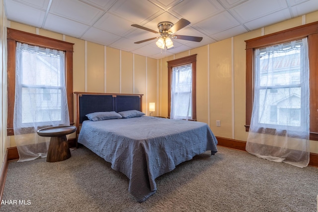213 N Market St, Martinsburg, PA 16662 - bedroom with carpet flooring, ceiling fan, and a decorative wall