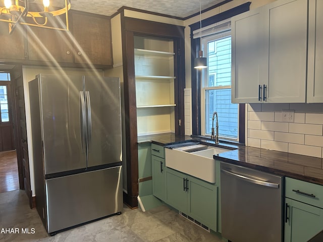 kitchen with white cabinetry, sink, green cabinets, a textured ceiling, and appliances with stainless steel finishes