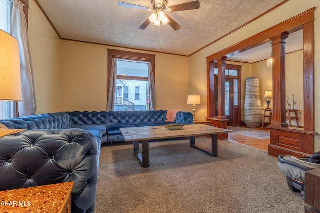 213 N Market St, Martinsburg, PA 16662 - living area with crown molding, ceiling fan, decorative columns, and carpet