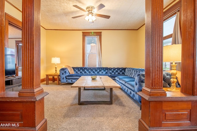 213 N Market St, Martinsburg, PA 16662 - carpeted living room with ornamental molding, a ceiling fan, and ornate columns