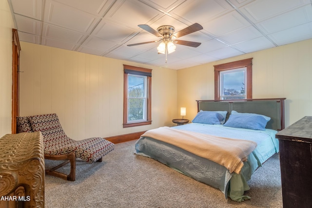 213 N Market St, Martinsburg, PA 16662 - carpeted bedroom featuring ceiling fan and wooden walls